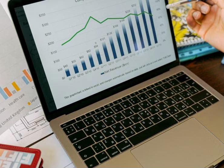 Illustrative photo: revenue charts on a laptop screen